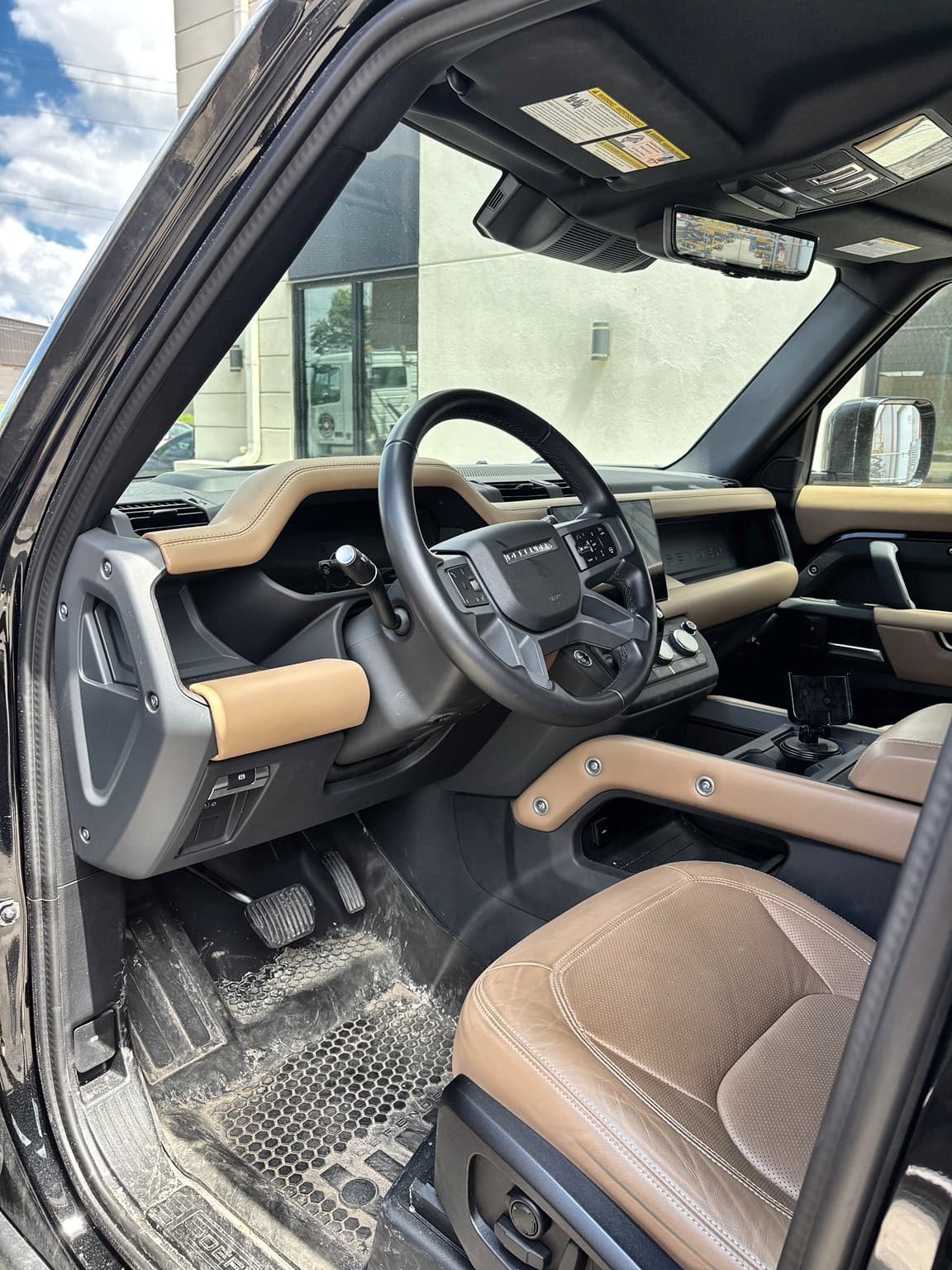 Land Rover Defender driver-side interior before detailing