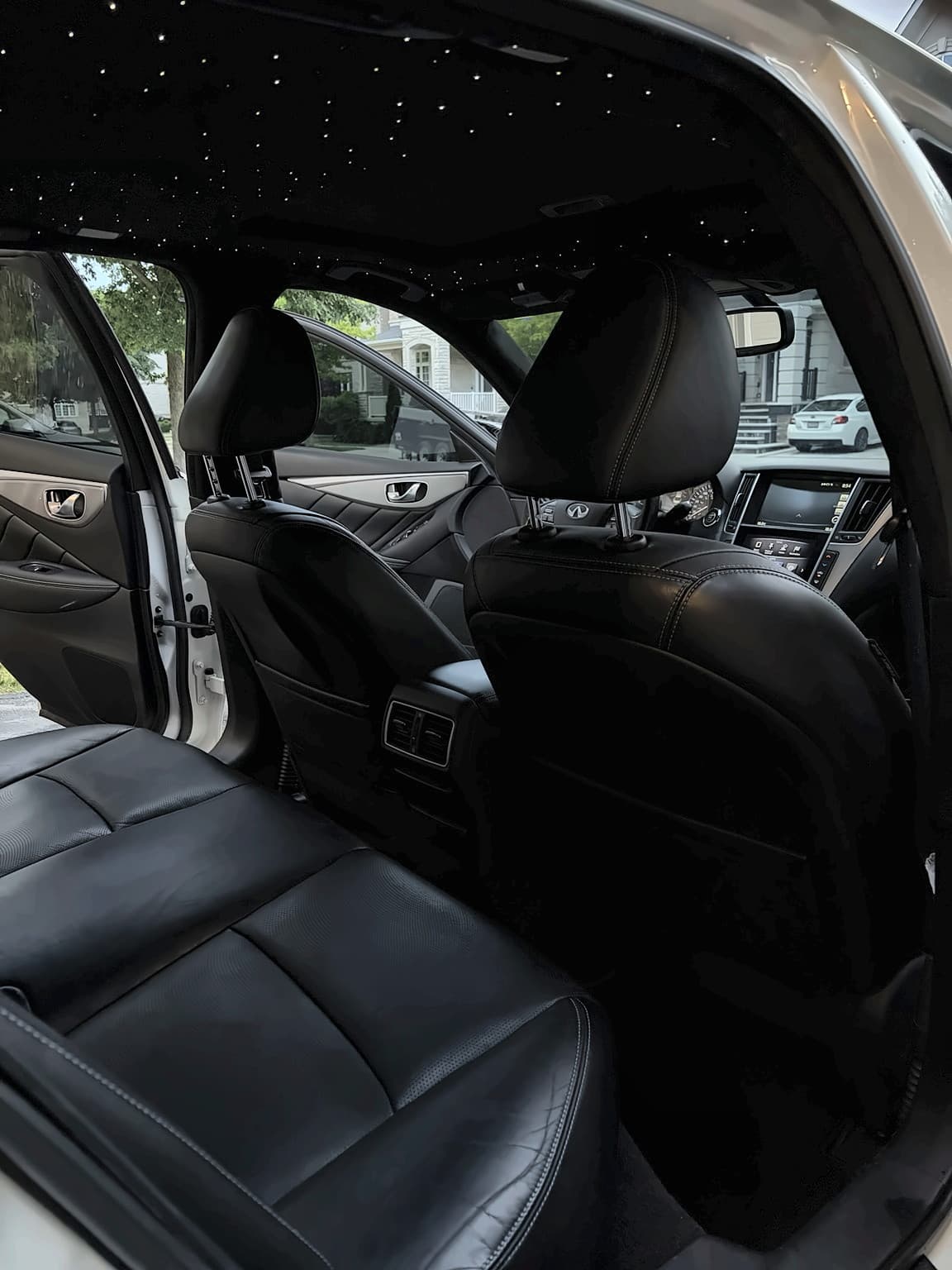 Infiniti interior with a clean cabin and illuminated starlight headliner